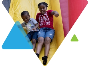 Happy Kids Playing On Slide