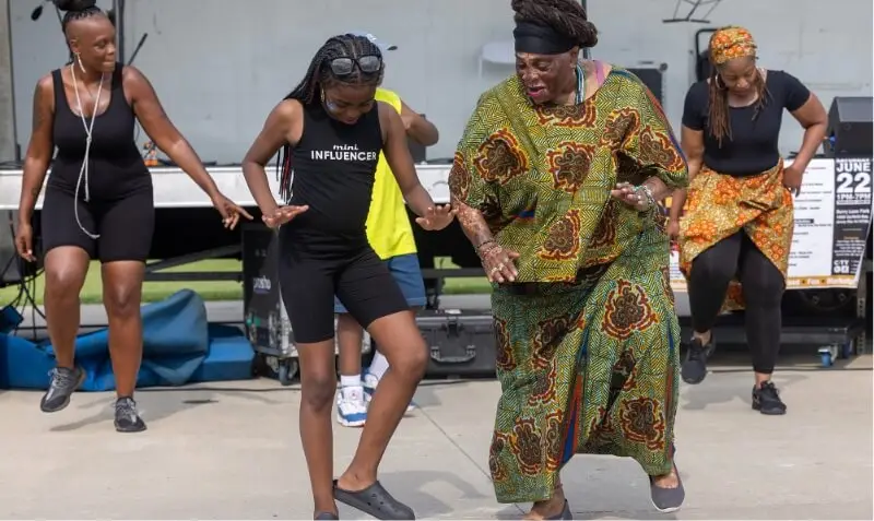 Group of women joyfully dancing together